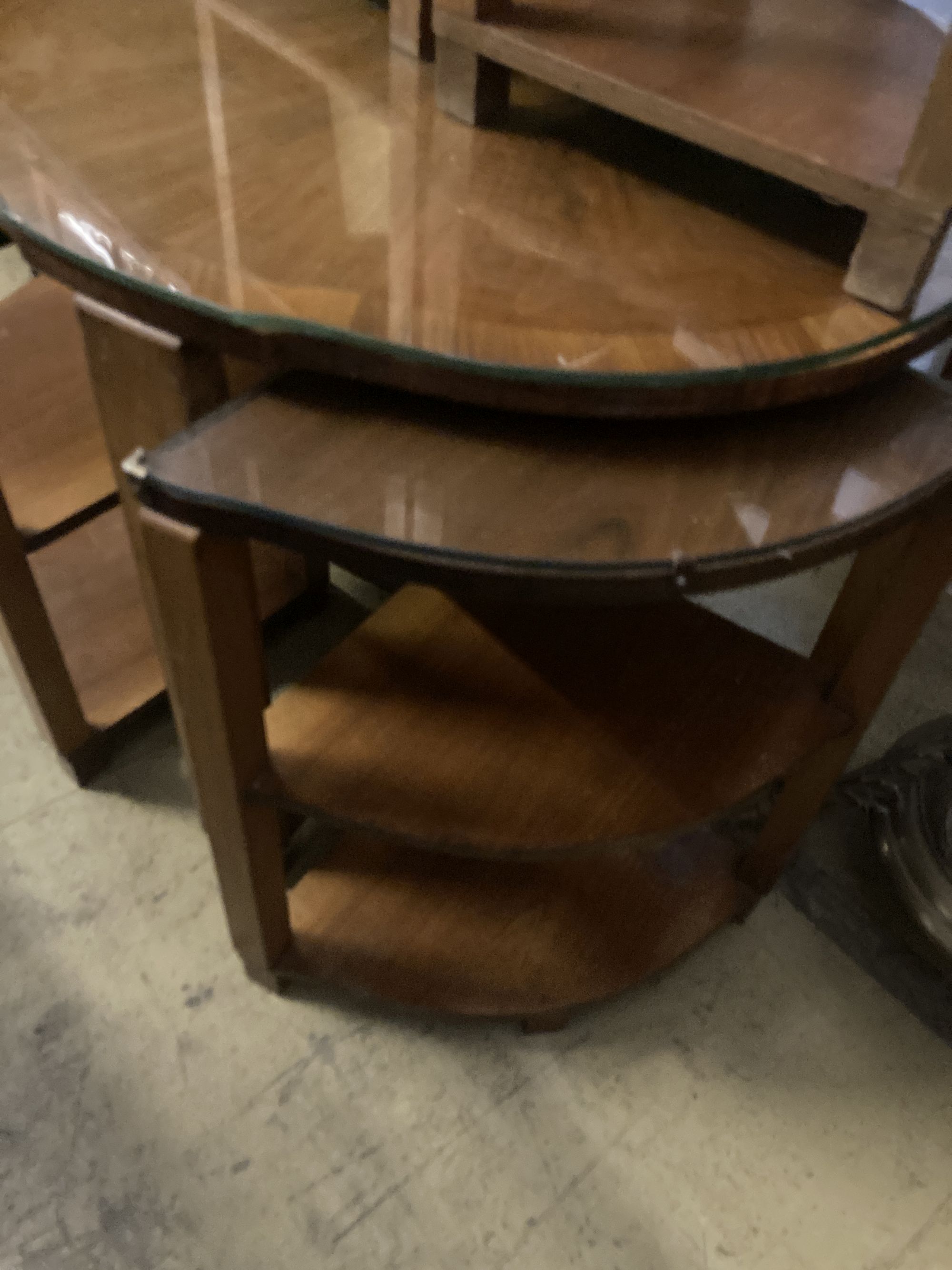 An Art Deco figured walnut nest of tables, n the manner of Epstein, diameter 74cm height 55cm